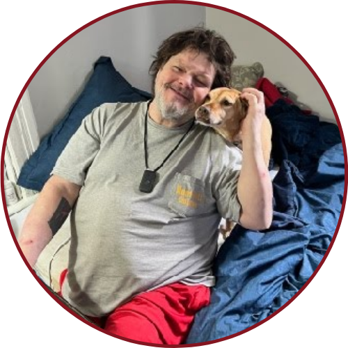 U.S. Marine Corps Veteran David Swift at home with his dog.